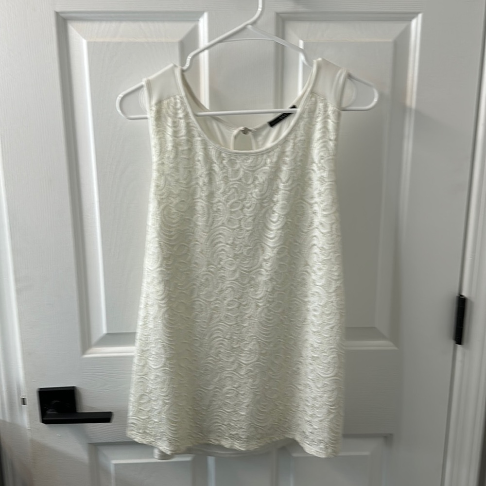 West Kei embroidered tank. Great for work or play. Color cream.